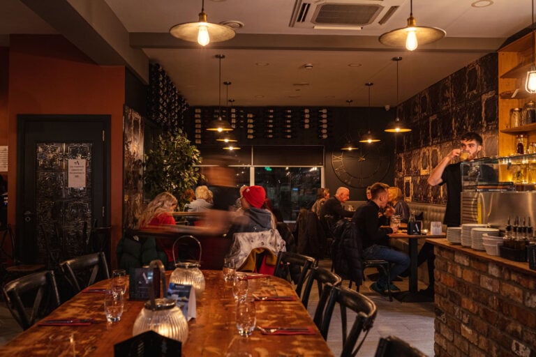 The warm dining room at Amici Portstewart