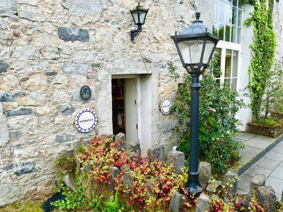 Entrance to the Nicholas Mosse shop and café in the old stone mill, Bennettsbridge